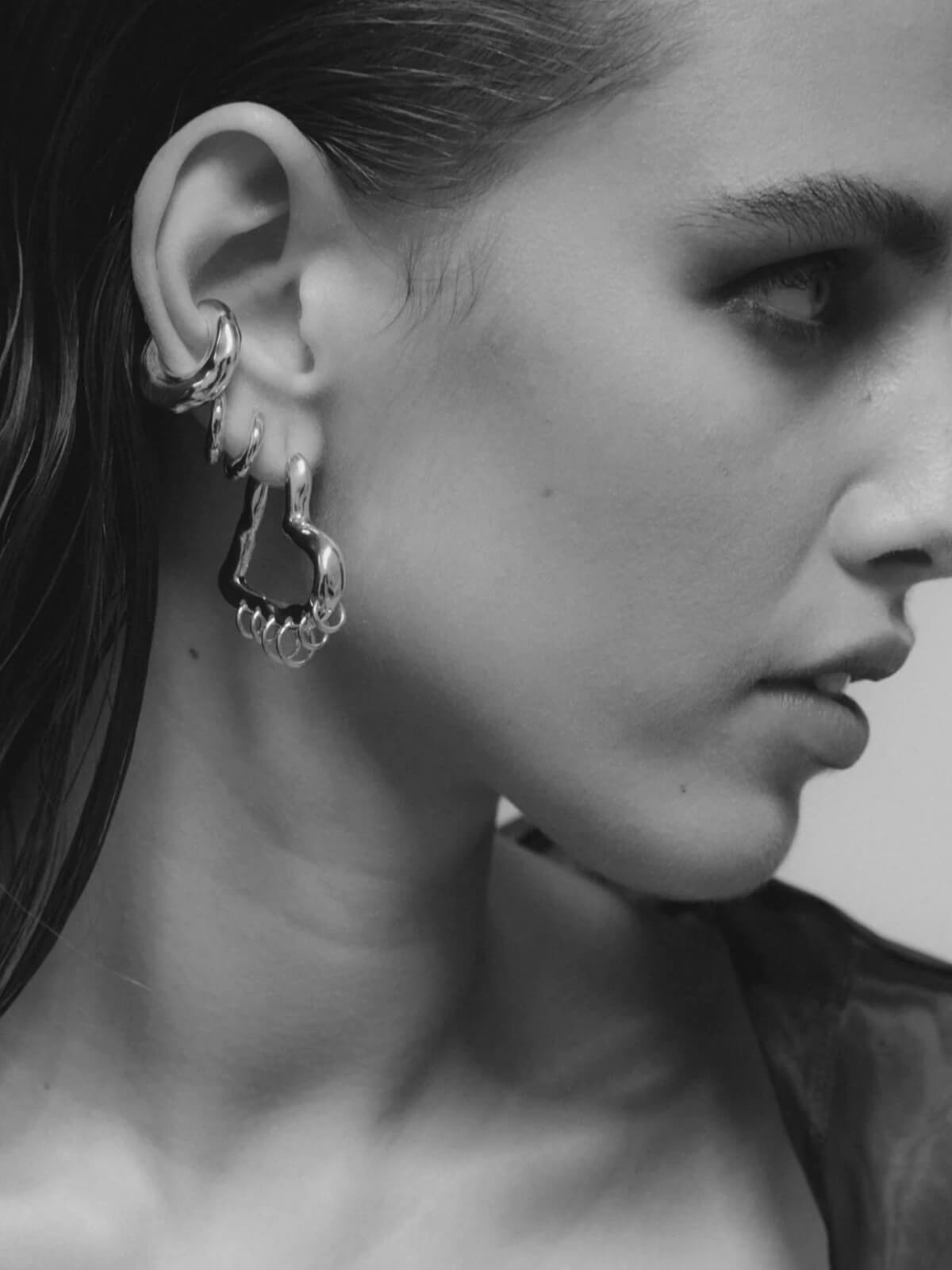 Tough Love Pierced Heart Hoop Earrings: Silver - 35mm